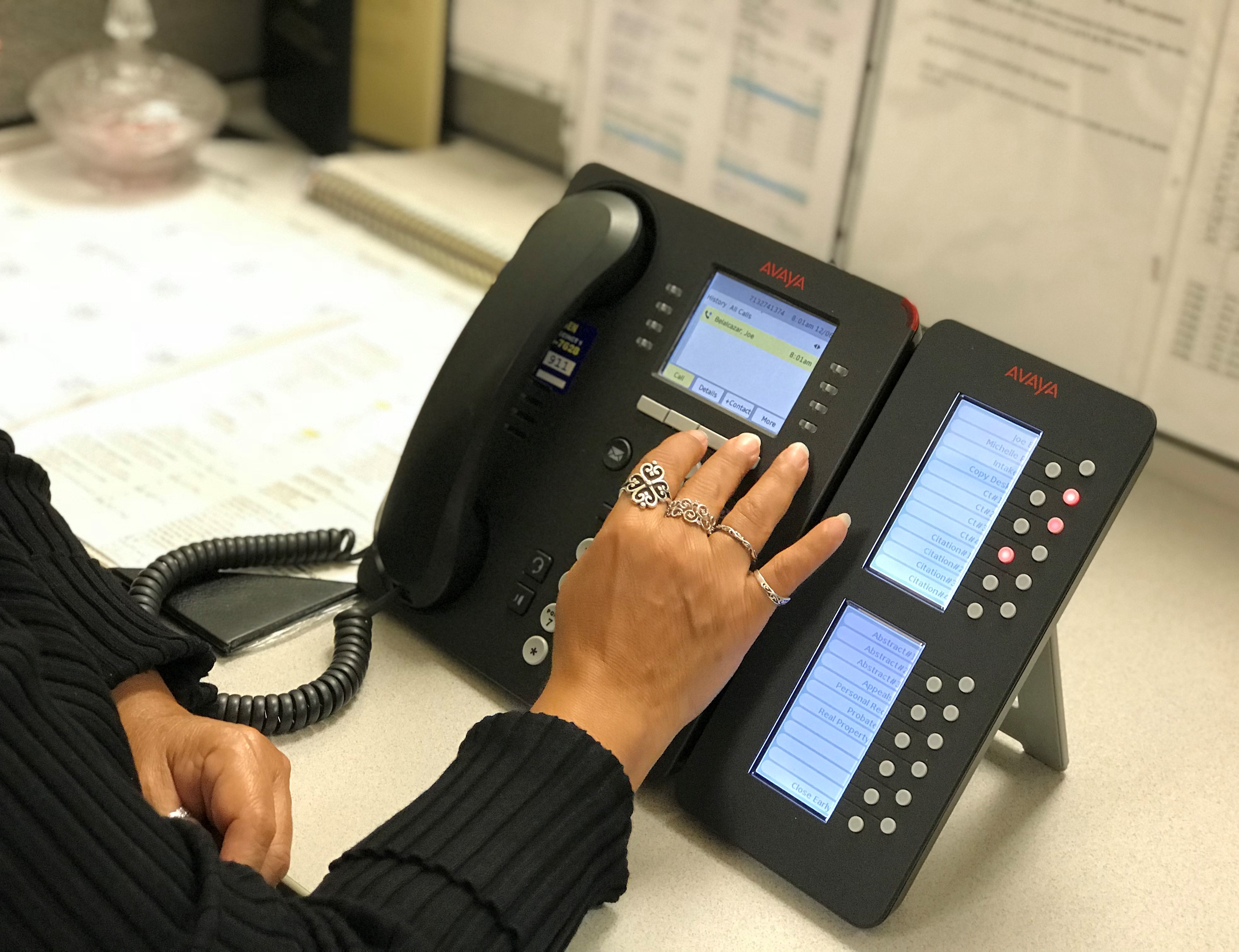 Photo of a clerk using a phone